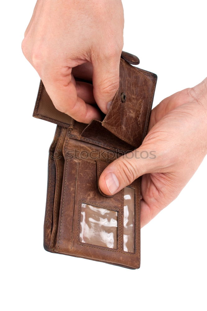 Similar – two female hands hold brown leather open empty wallet for cash