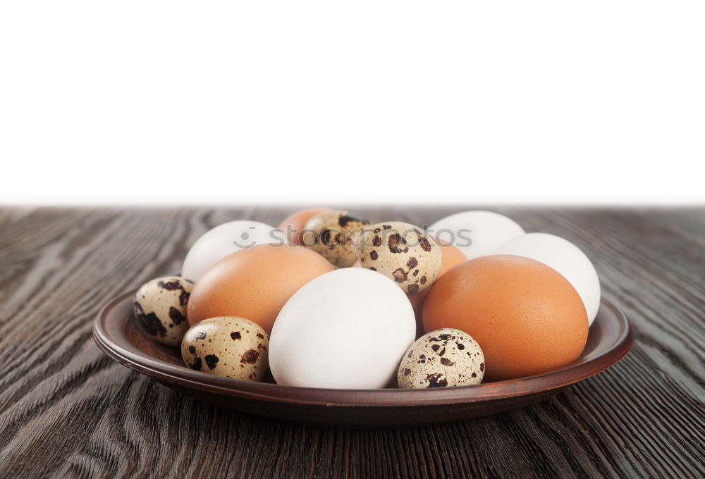 Similar – Image, Stock Photo Three fresh quail eggs on a gray wooden surface