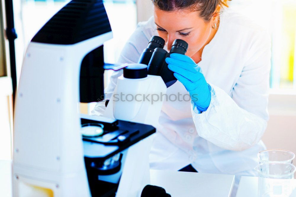 Image, Stock Photo Woman looking at microscope