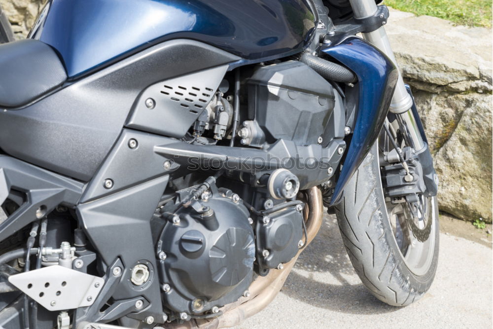 Similar – Image, Stock Photo Biker checking with a motorcycle