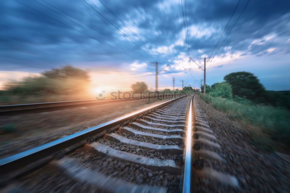 Similar – Image, Stock Photo High-speed train moving through nature at sunset