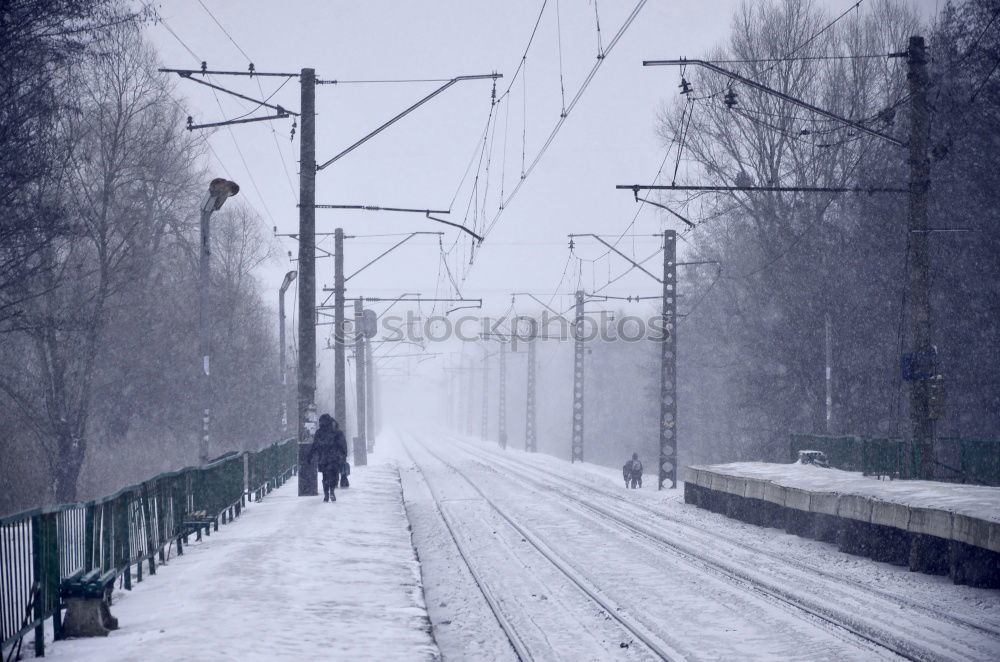 Frozen clock in snowy train station