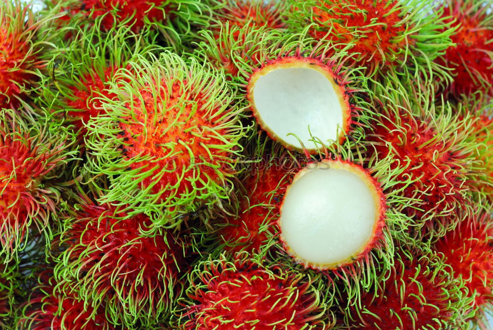 Similar – fresh tropical rambutan fruits over rustic wood table