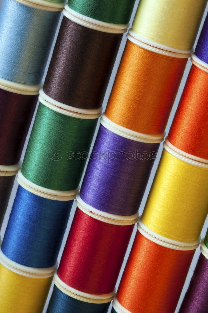 Similar – Image, Stock Photo Five old sewing thread thread rolls in pastel colours on wood
