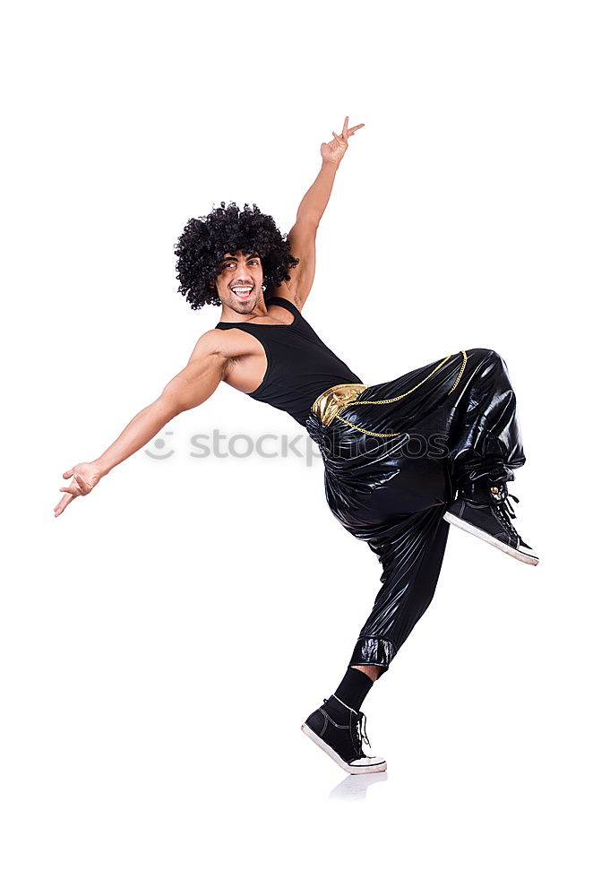 Woman with afro hair climbing by children’s attractions.