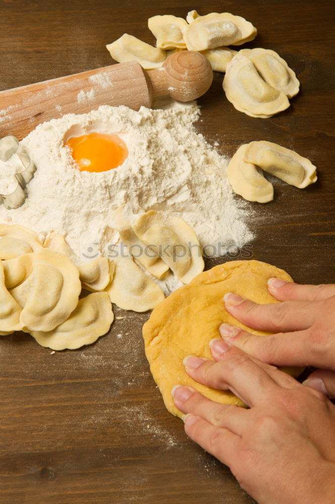 Similar – Image, Stock Photo Chef in black jacket, kneads dough