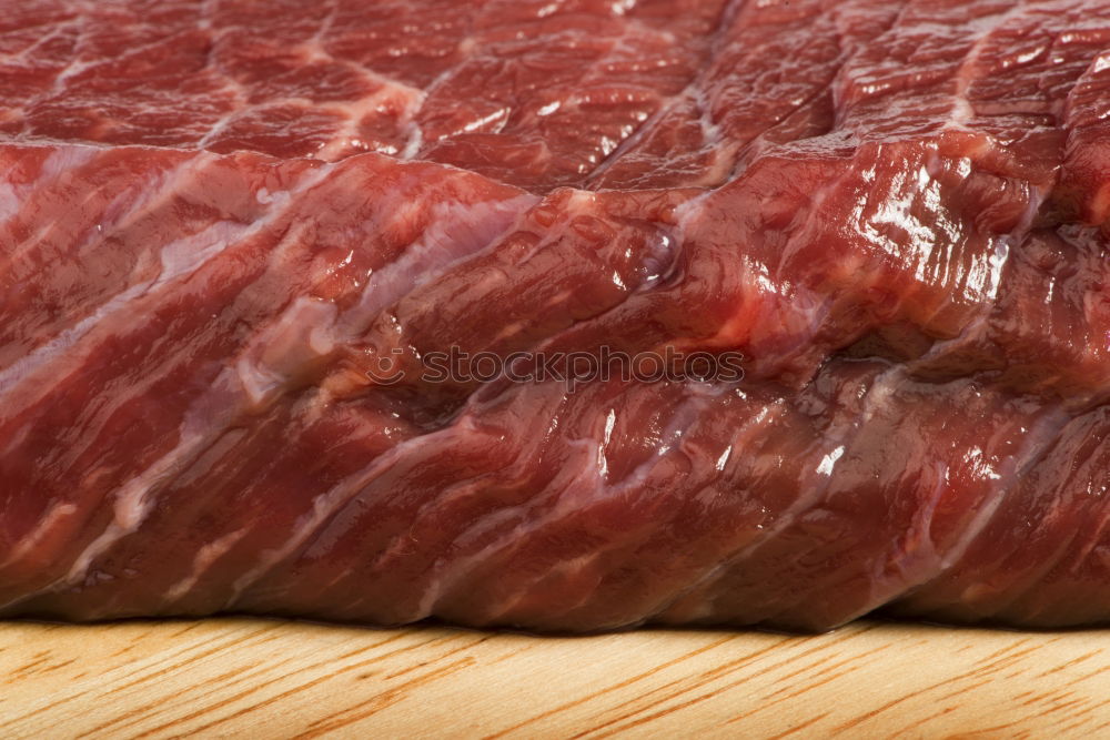 Similar – Image, Stock Photo Cutter carving slices from a whole bone-in serrano ham