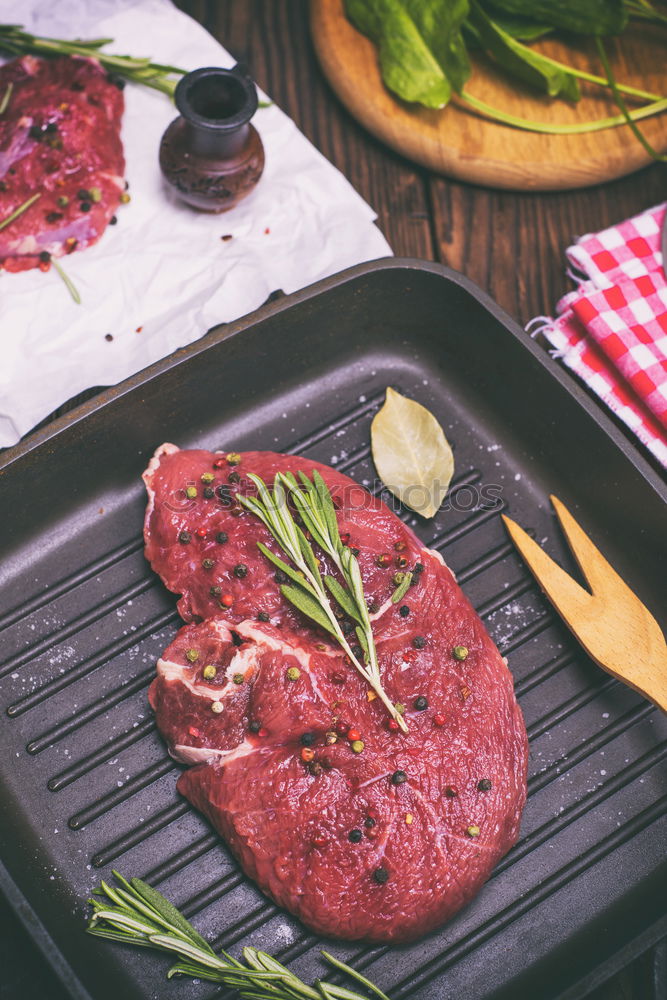 raw beef steak in spices