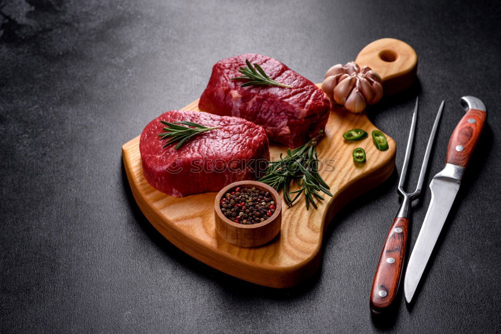 Similar – Image, Stock Photo Steaks with ingredients on a round chopping board