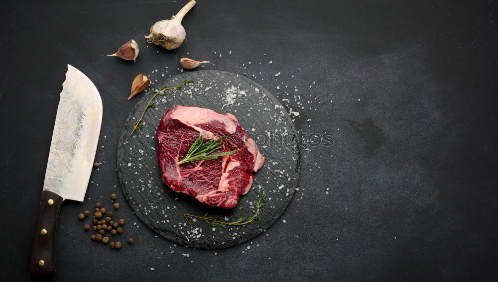 Similar – Image, Stock Photo Steaks with ingredients on a round chopping board