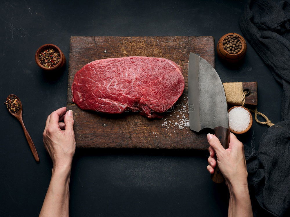 Similar – Image, Stock Photo T-bone steak on grill pan with meat fork, oil and spices