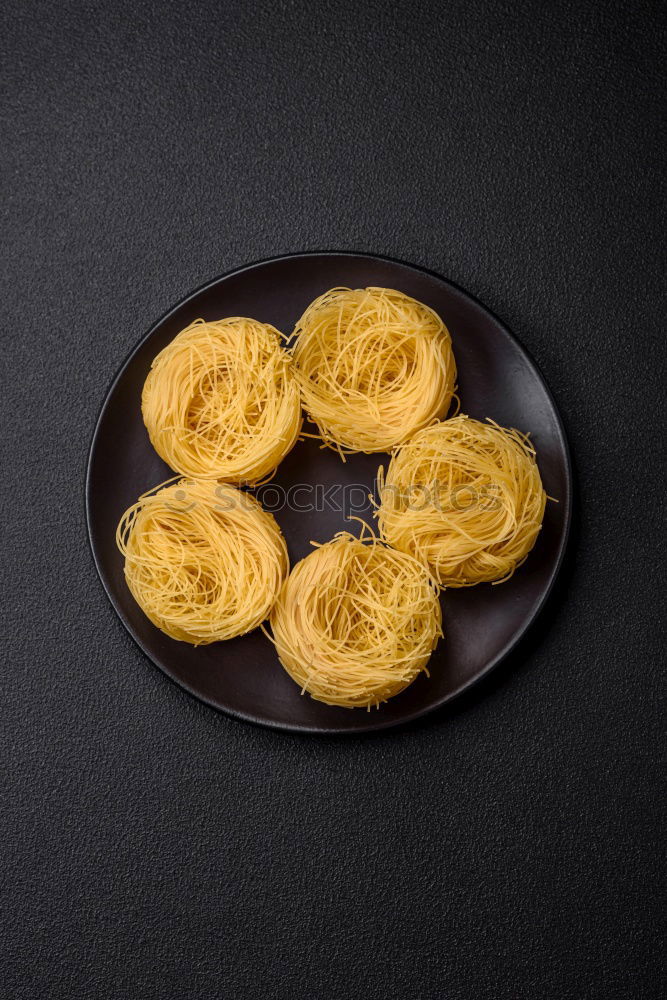 Similar – Raw tagliatelle on dark table