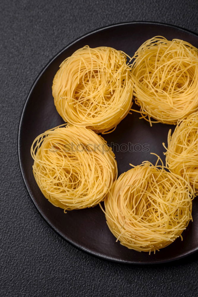 Similar – Raw tagliatelle on dark table