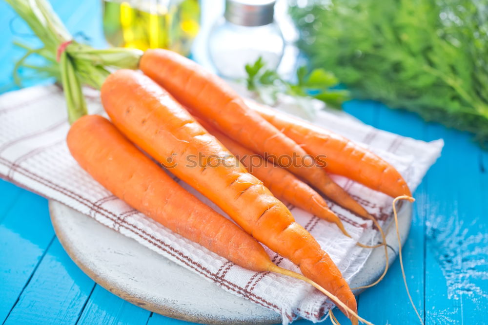 Similar – Large fresh carrots in a female hand