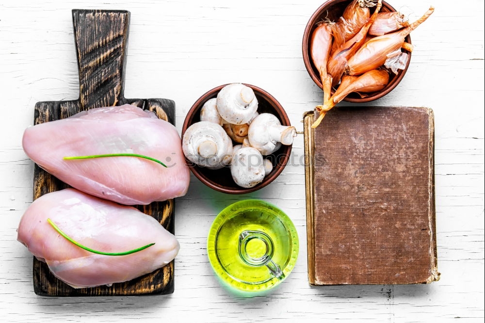 Similar – Raw prawn or shrimps and squids on light blue background, decorated with with seaweeds and lemon, top view, flat lay. Seafood cooking concept