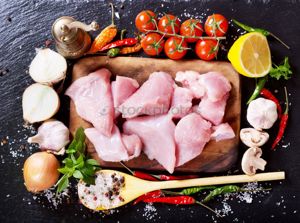 Similar – Image, Stock Photo Raw chicken legs with mushrooms, spices and herbs