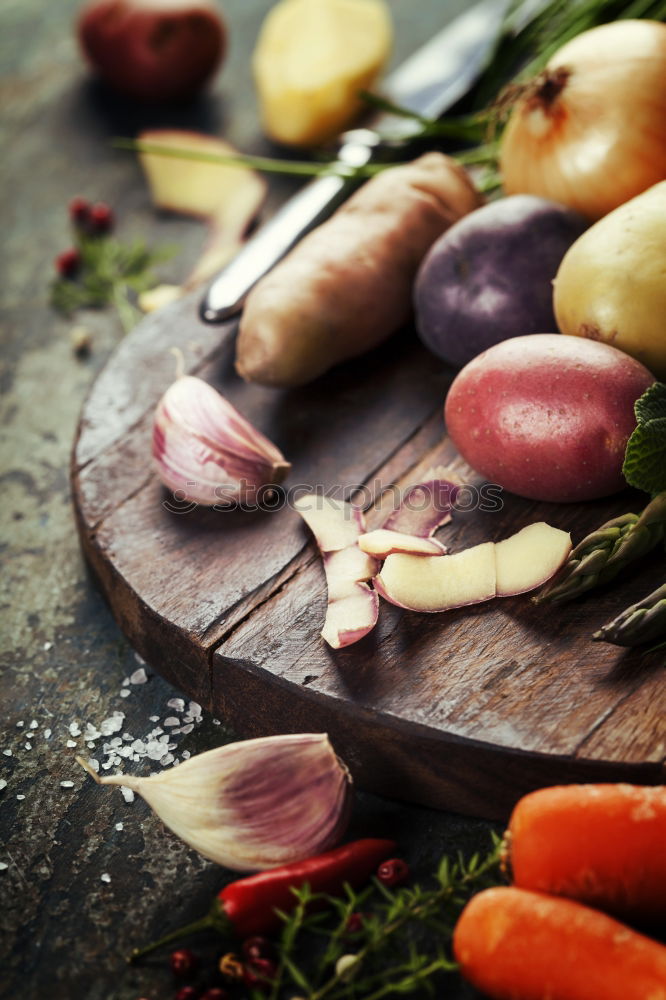 Similar – Image, Stock Photo Preparing young potatoes on a wooden table