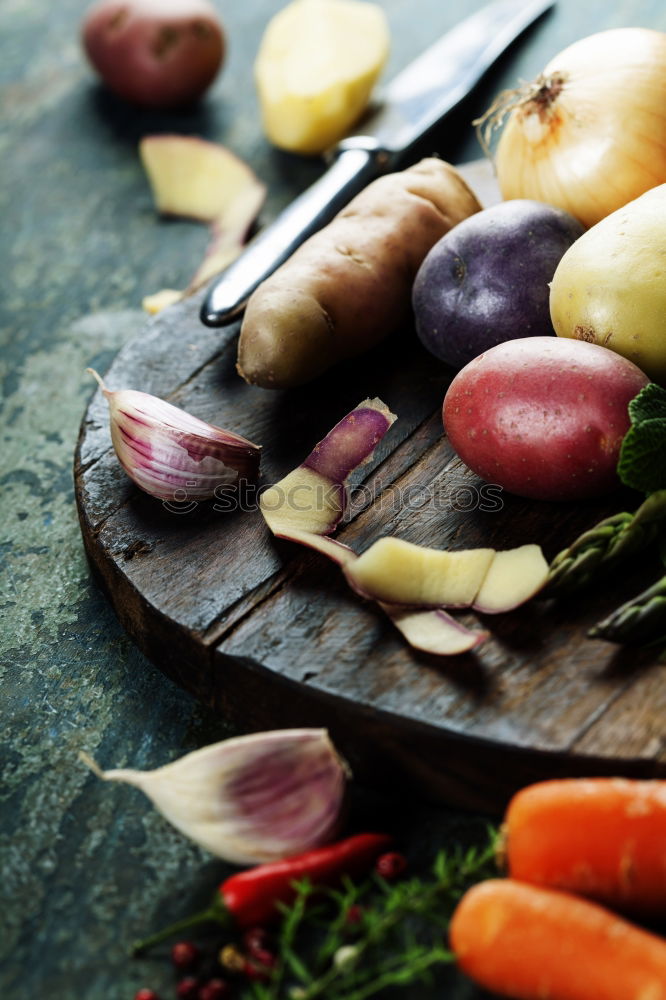 Similar – Image, Stock Photo Preparing young potatoes on a wooden table