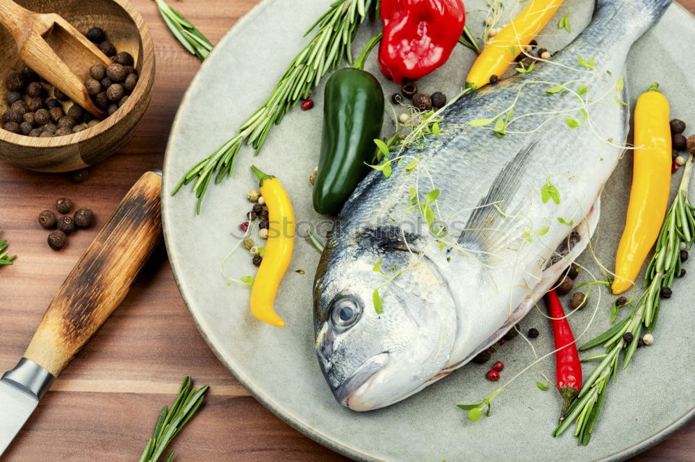 Similar – Image, Stock Photo Raw salmon fish in ice and vegetables