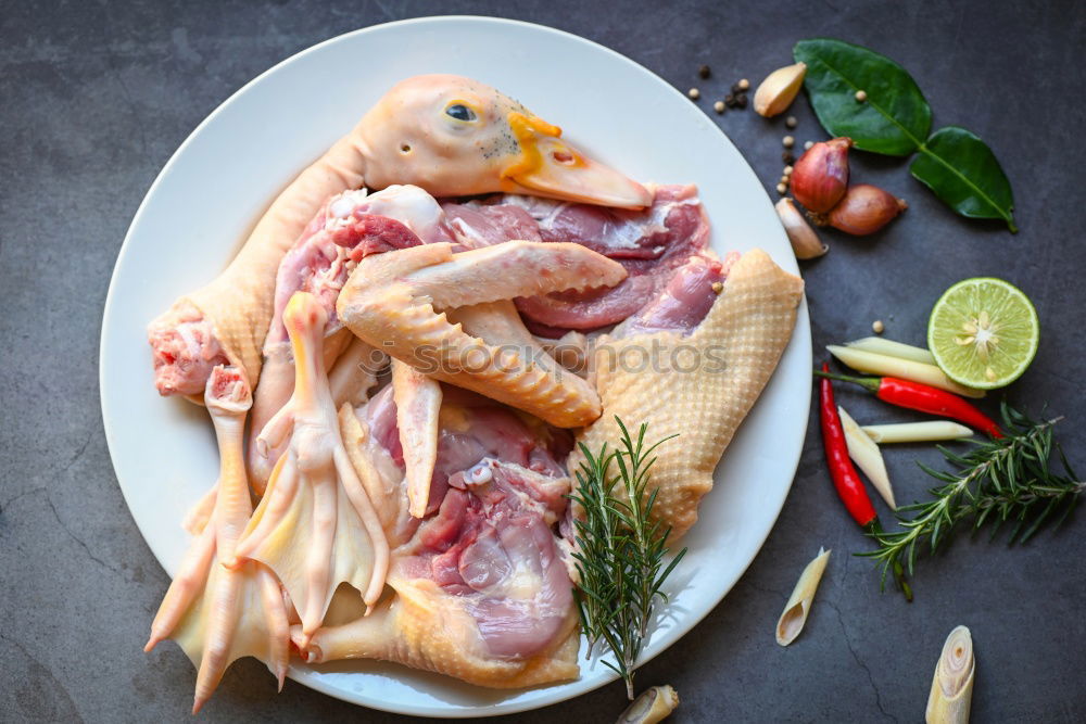 Similar – Image, Stock Photo Raw chicken legs with mushrooms, spices and herbs