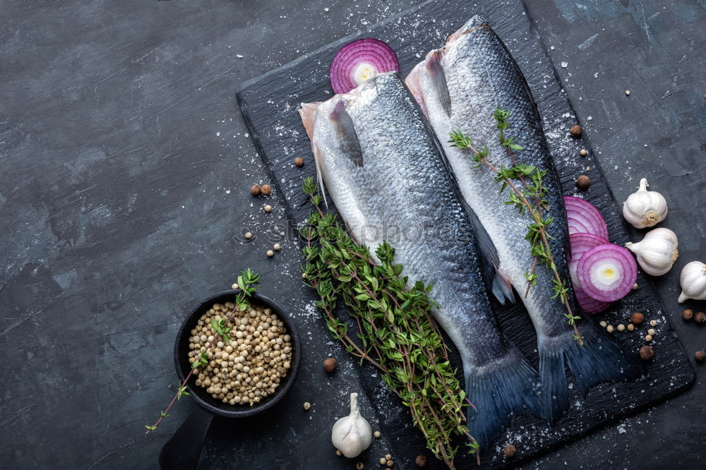 Similar – Carp with spices in a black cast-iron frying pan