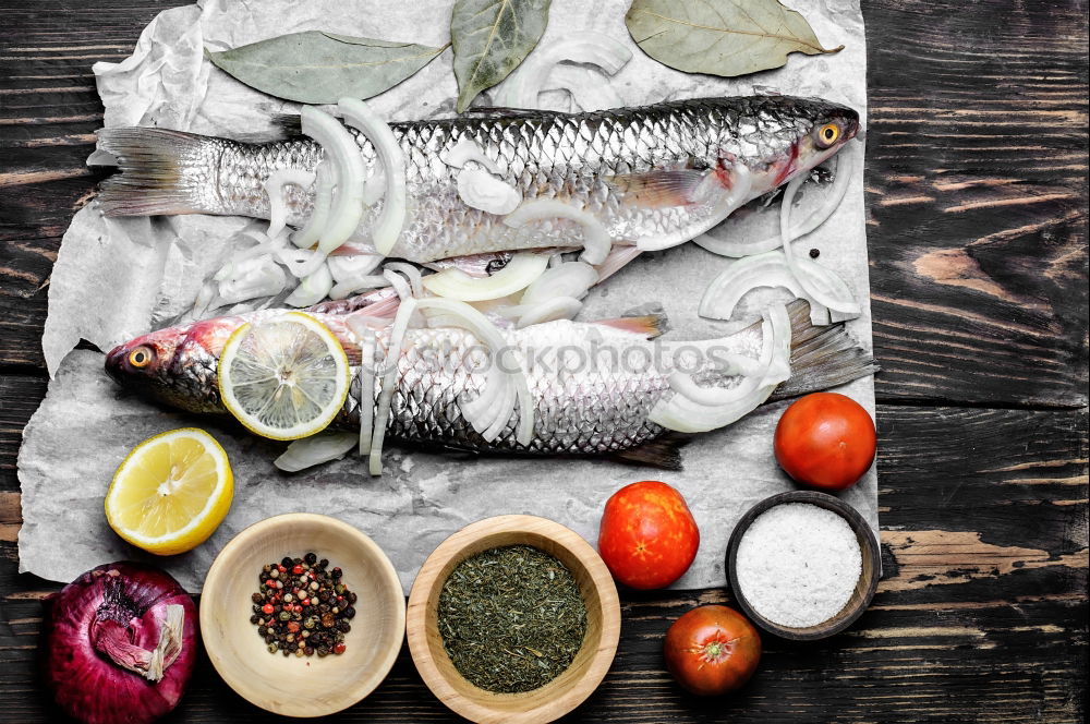 Similar – Image, Stock Photo Fish fillets with kitchen knife and spices