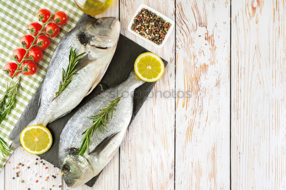 Similar – Image, Stock Photo Raw salmon fish in ice and vegetables