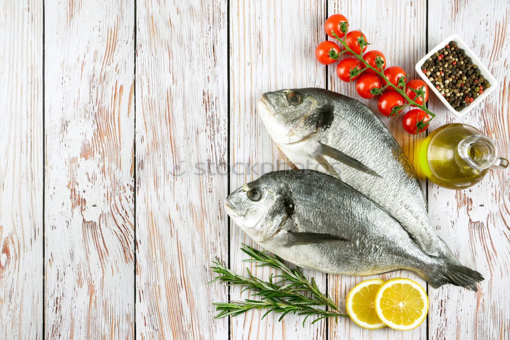 Similar – Image, Stock Photo Raw salmon fish in ice and vegetables