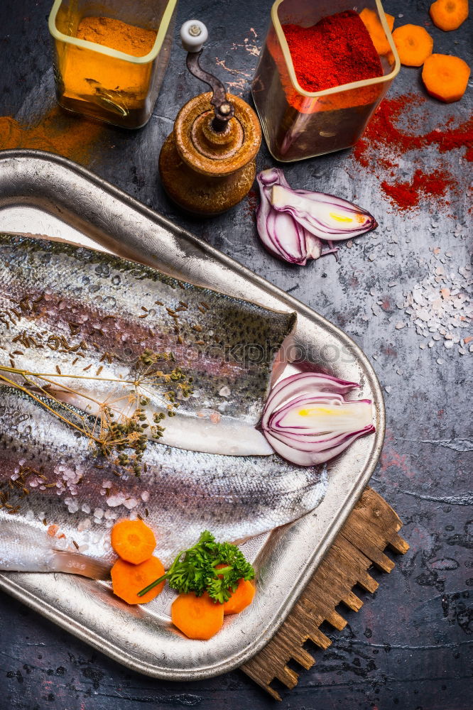 Similar – Image, Stock Photo Fish fillets with kitchen knife and spices