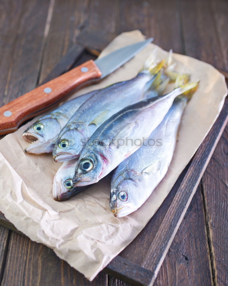 Similar – Image, Stock Photo Raw fish wrapped in paper