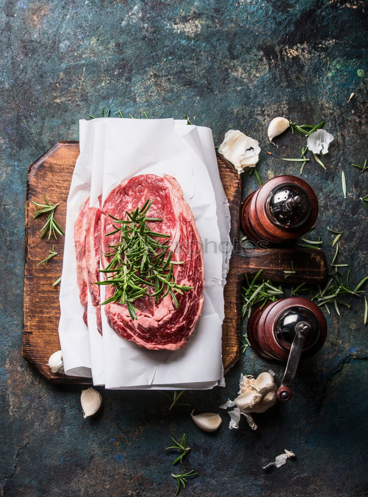 Similar – Image, Stock Photo Steaks with ingredients on a round chopping board