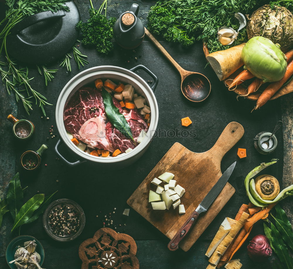 Similar – Asian food background with wok pan with vegetarian  korean hot pot and chopsticks on dark rustic kitchen table background, top view. Copy space.