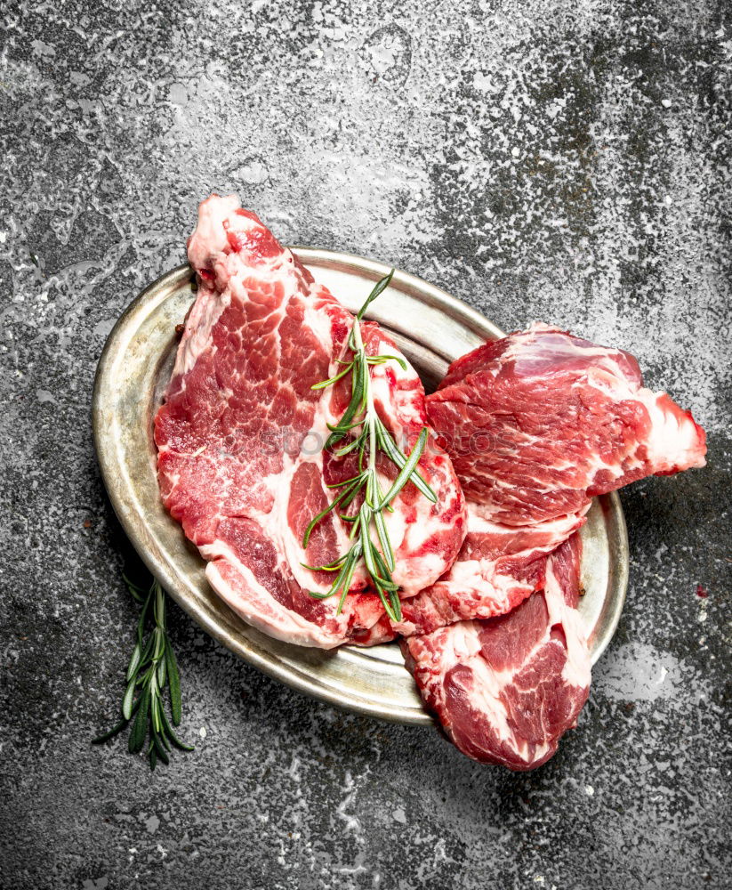 Similar – Image, Stock Photo Prepare steaks with herbs and butter