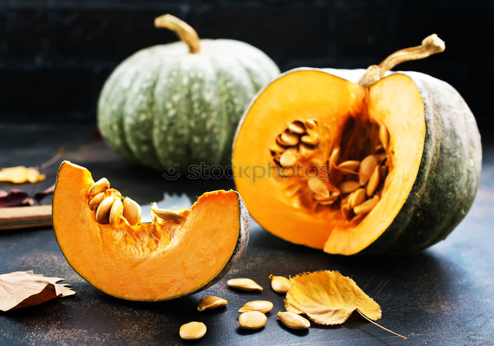 Similar – Image, Stock Photo Half pumpkin with seeds and cooking spoon