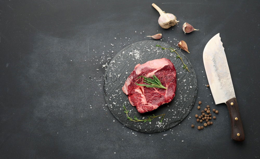 Similar – Image, Stock Photo Steaks with ingredients on a round chopping board