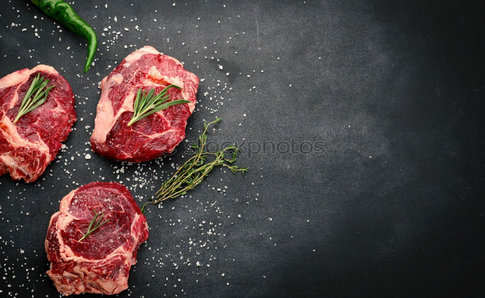 Similar – Image, Stock Photo Steaks with ingredients on a round chopping board