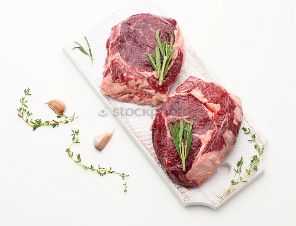 Similar – Image, Stock Photo Lamb cutlet with oil and rosemary