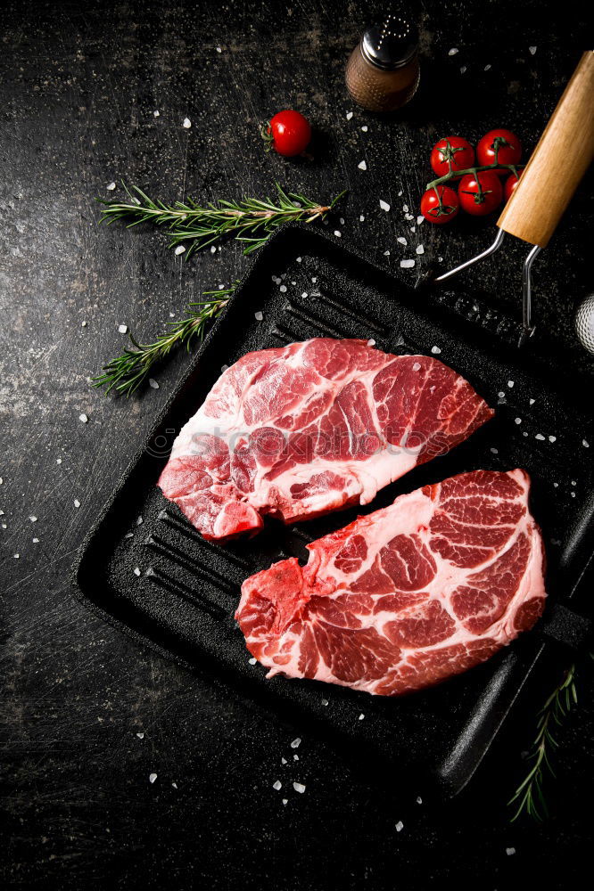 Similar – Image, Stock Photo T-bone steak on grill pan with meat fork, oil and spices