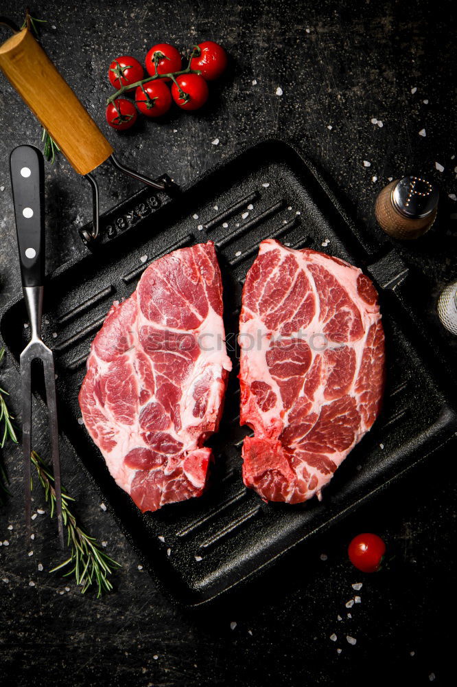 Similar – Image, Stock Photo T-bone steak on grill pan with meat fork, oil and spices