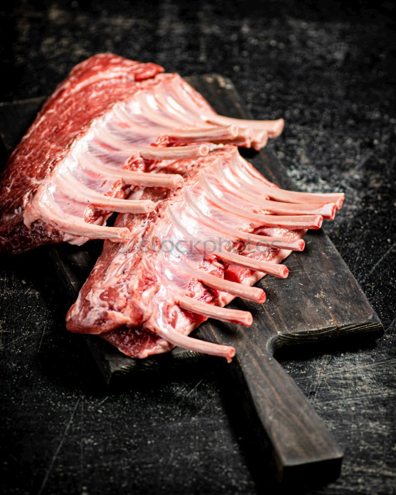 Similar – Image, Stock Photo Lamb Racks on kitchen table with green ingredients