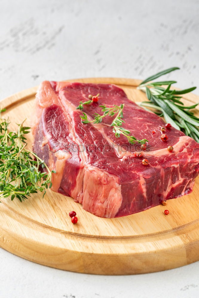 Similar – Image, Stock Photo Prepare steaks with herbs and butter