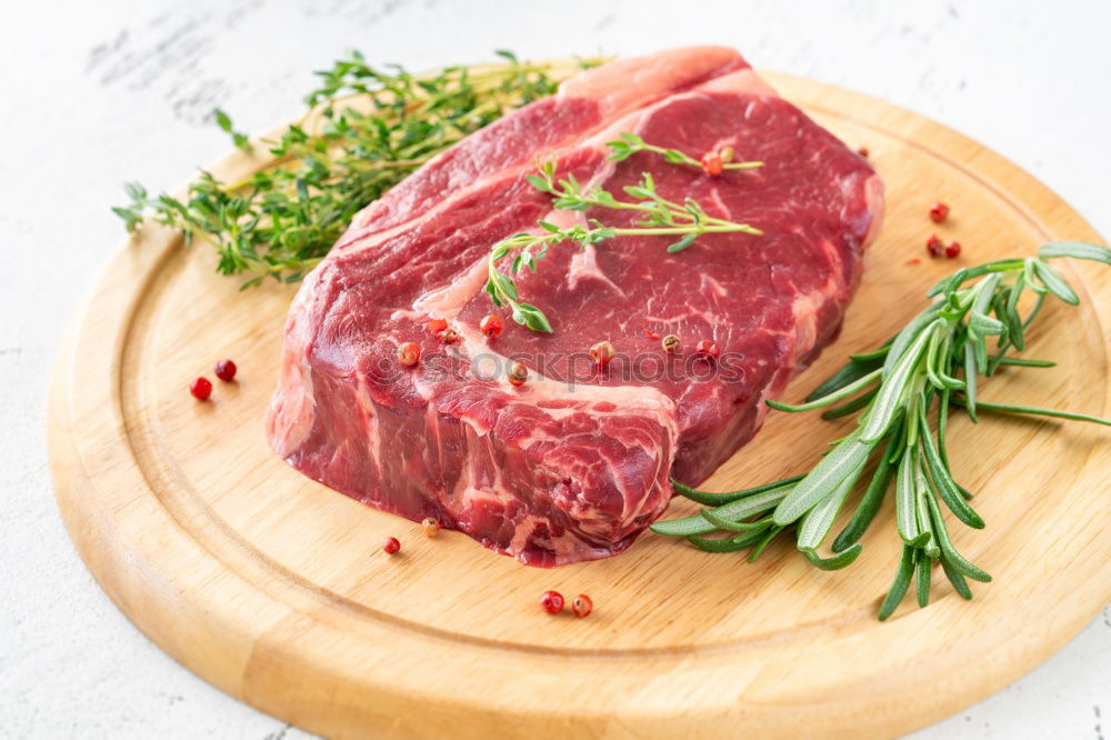 Similar – Image, Stock Photo Prepare steaks with herbs and butter