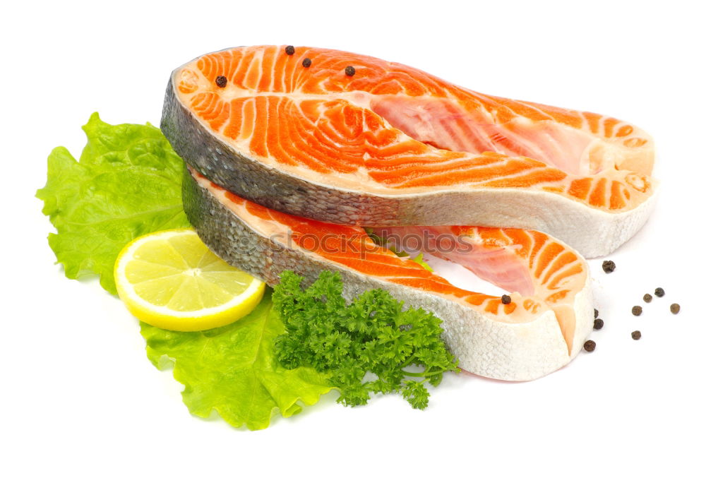 Similar – Raw salmon fillet with green herbs and lemon