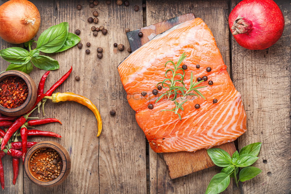 Similar – Salmon fillet with ingredients on a rustic wooden table