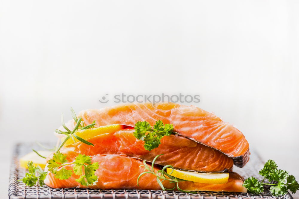 Similar – Image, Stock Photo Salmon fish fillet with lemon on white chopping board