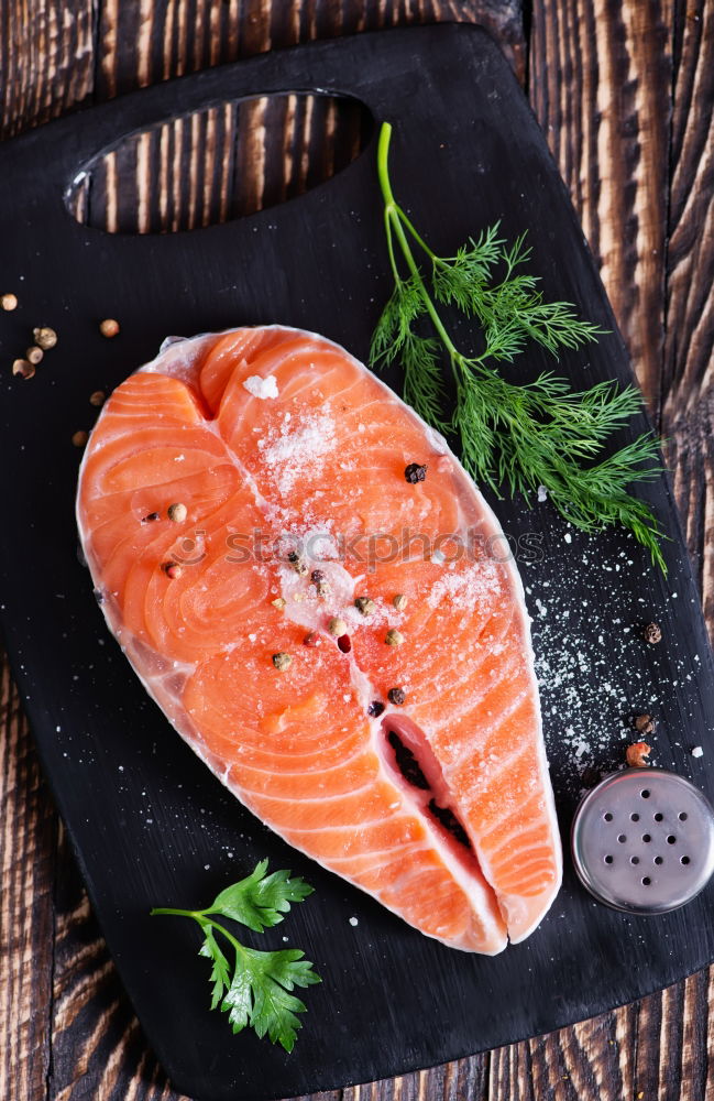 Similar – Image, Stock Photo Salmon fish fillet with lemon on white chopping board