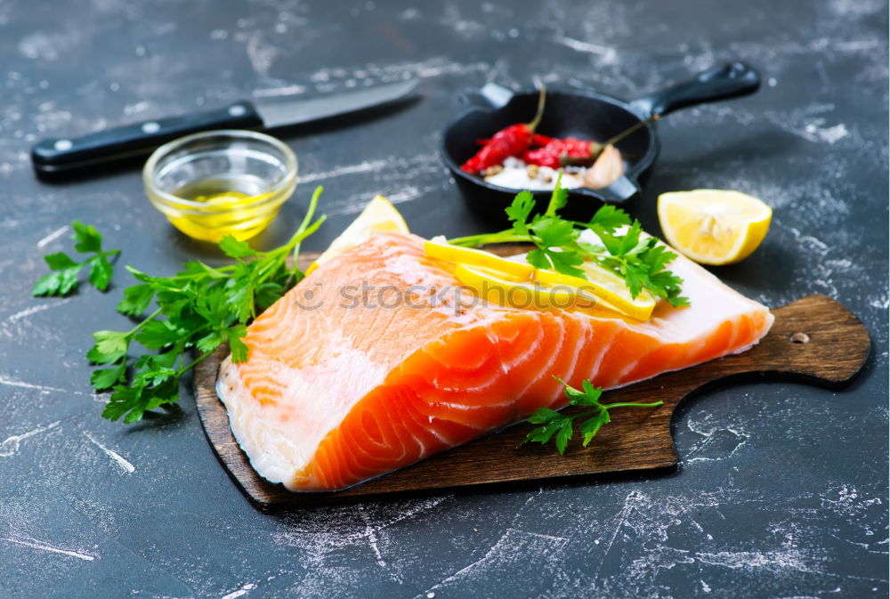 Similar – Salmon fish fillet with lemon in bowl