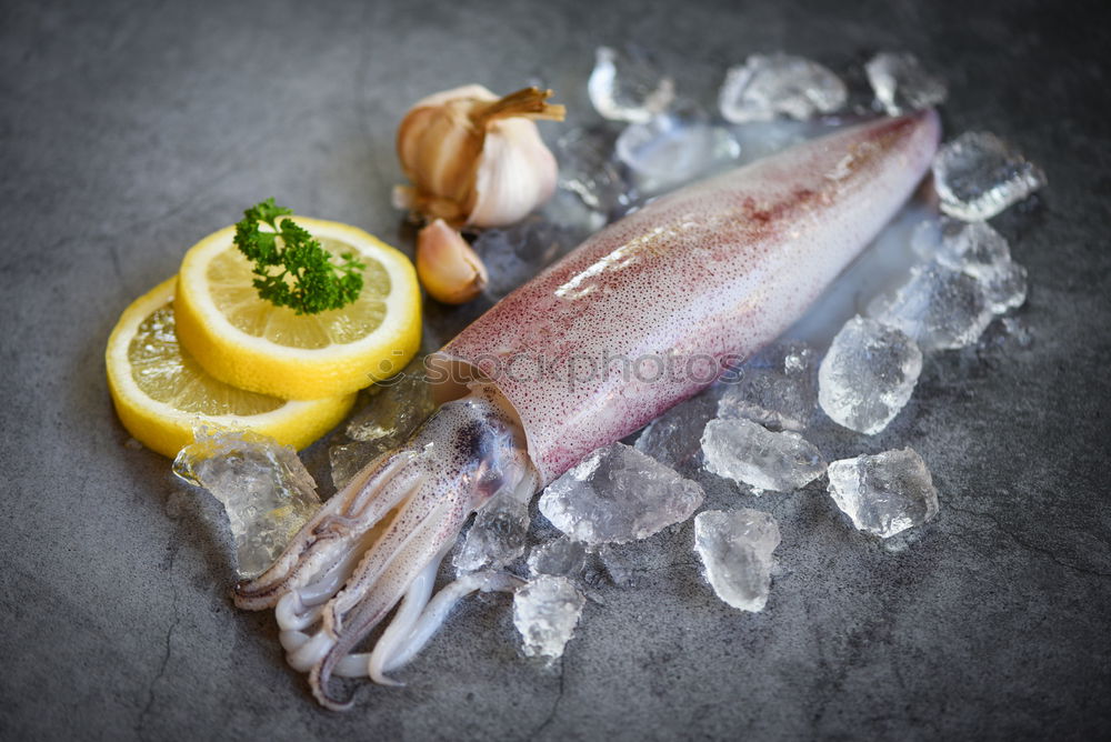 Similar – Red onion and lemon on zander fish