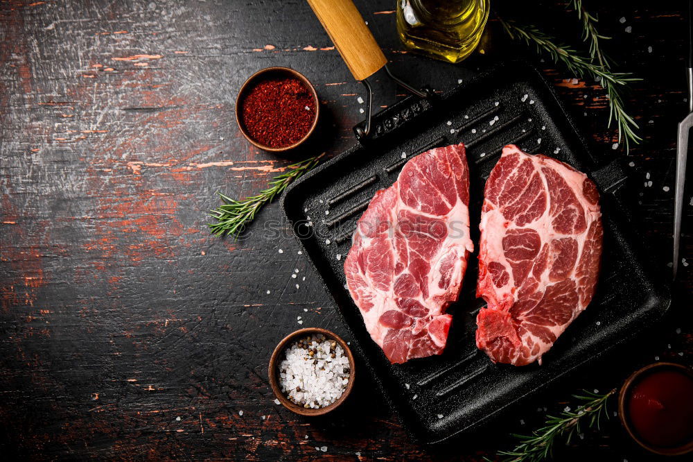 Similar – Image, Stock Photo T-bone steak on grill pan with meat fork, oil and spices