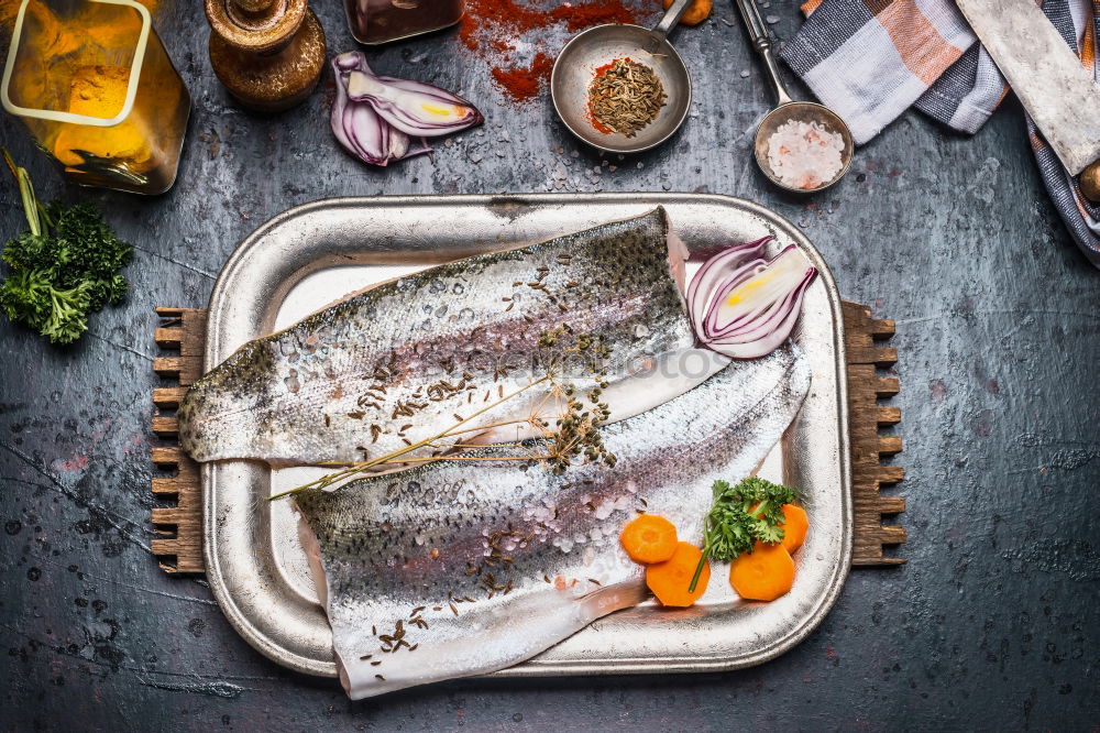 Fish fillet preparation with vegetables, fennel seeds and spices